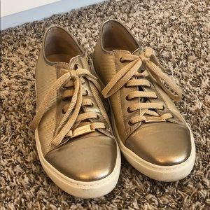 Gold tennis shoes